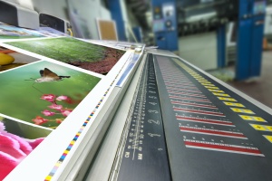 offset printing machine workin on Digital Commercial Printing services 
