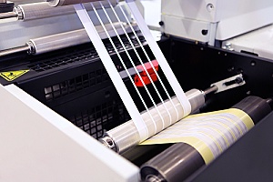 a commercial die cutting machine being used to create designs