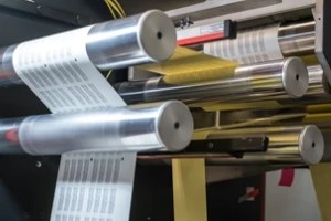 printinr machine rollers in action at a Commercial Printing Services