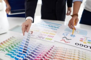 A man is checking color samples of a commercial printing company