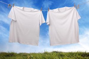 Two white t-shirts handing dry