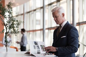 A businessman reading a magazine