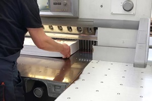 man taking bulk prints from machine