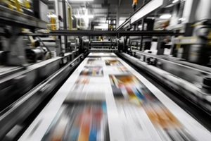 printing press with large printing presses churning out newspapers and magazines